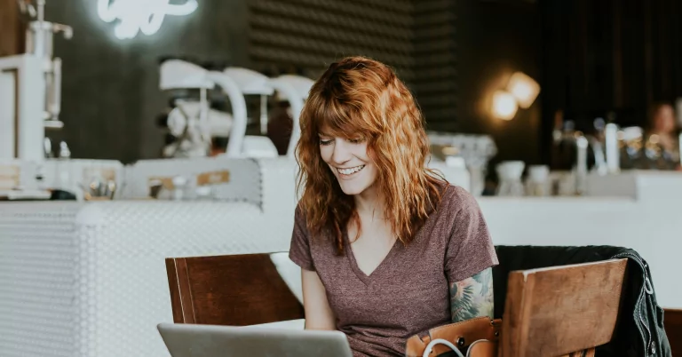 Image of a lady having a nice time in a restaurant